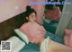 A woman laying on a bed in front of a mirror.
